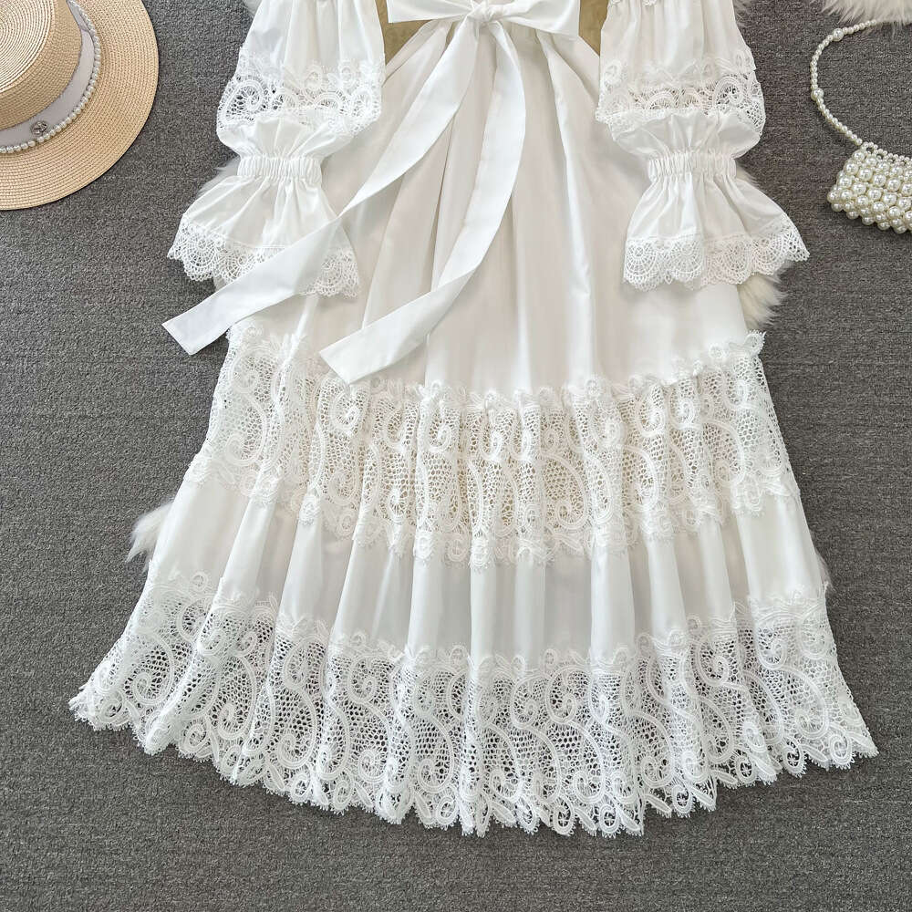 Designer fashion long sleeved V-neck pleated waist slim fit A-line hollow lace dress paired with elegant long skirt