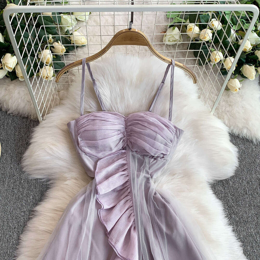 Designer seaside vacation style dress, chest cushion, shoulder strap, slim fit, elegant mesh splicing, sexy ruffles