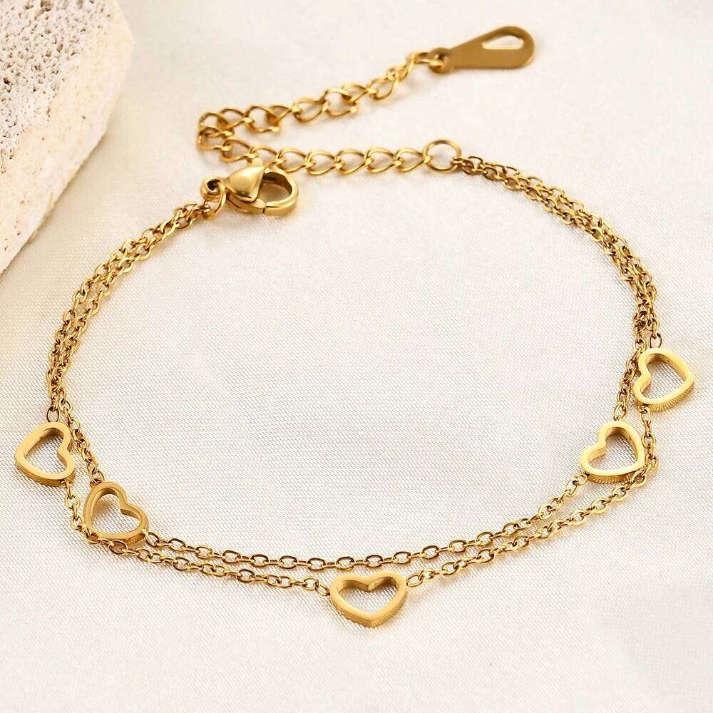 A fashionable classic stainless steel 18K gold bracelet with a hollowed-out heart-shaped chain and layered adjustment Z260313