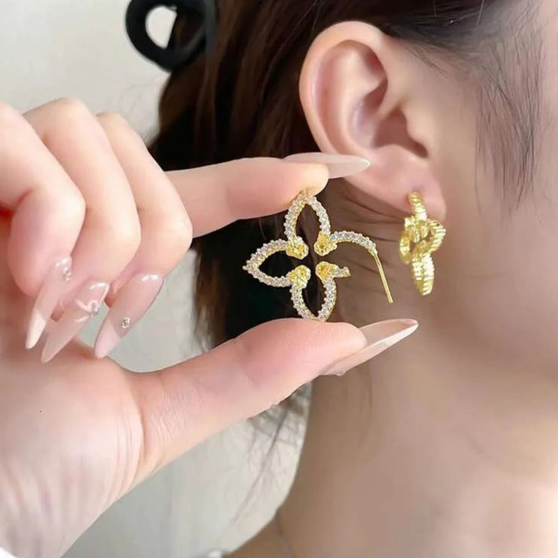 Dhcollections New Arrival Classic Four Leaf Flower Stud Earrings For Women High Quality Copper jewelry Fashion Exquisite Designer Jewelry Gift
