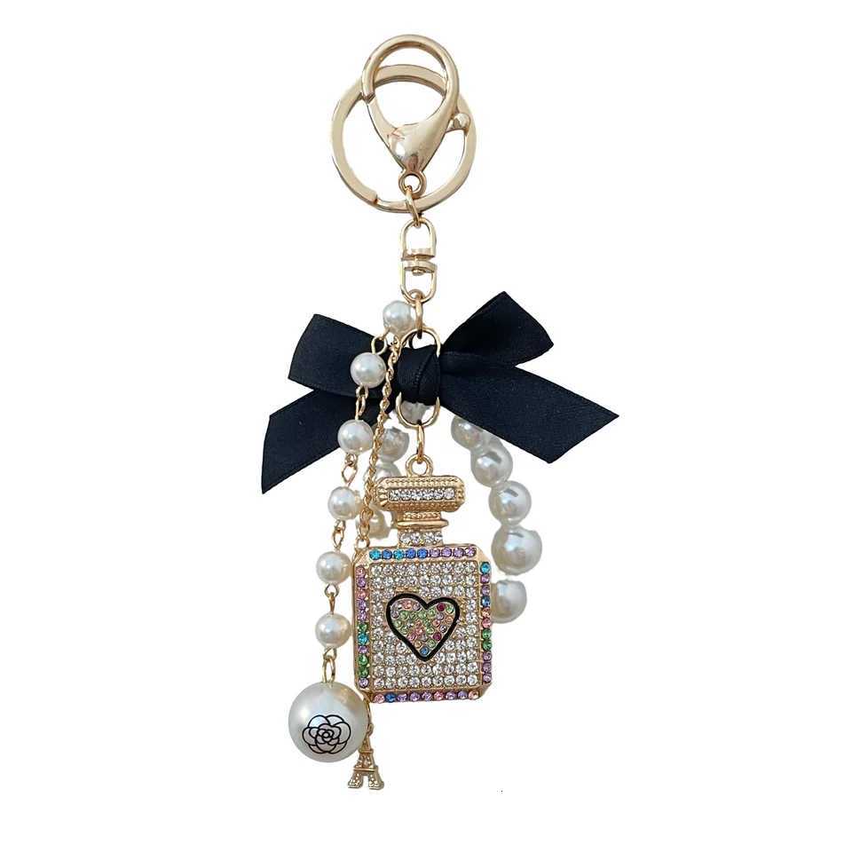 2024 New Luxury Crystal Perfume Bottle Keychain Pearl Bow Key Ring Eiffel Tower Womens Bag Pendant Souvenir Gift H260318 - view 7