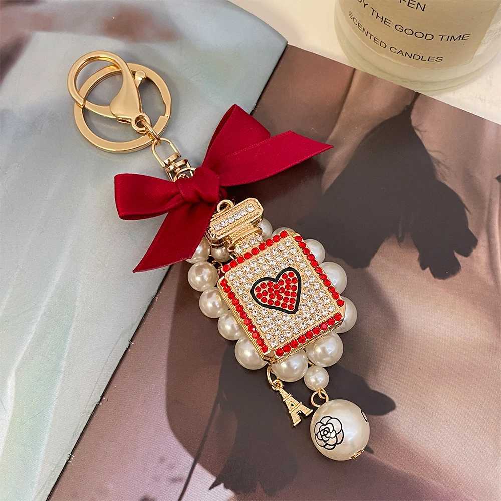 2024 New Luxury Crystal Perfume Bottle Keychain Pearl Bow Key Ring Eiffel Tower Womens Bag Pendant Souvenir Gift H260318 - view 4