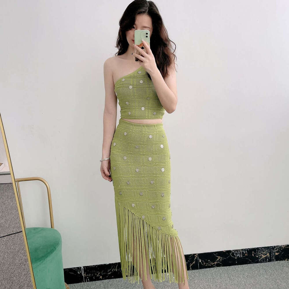 New designer French S6 niche vacation style single shoulder strap tassel knit skirt for summer 2026