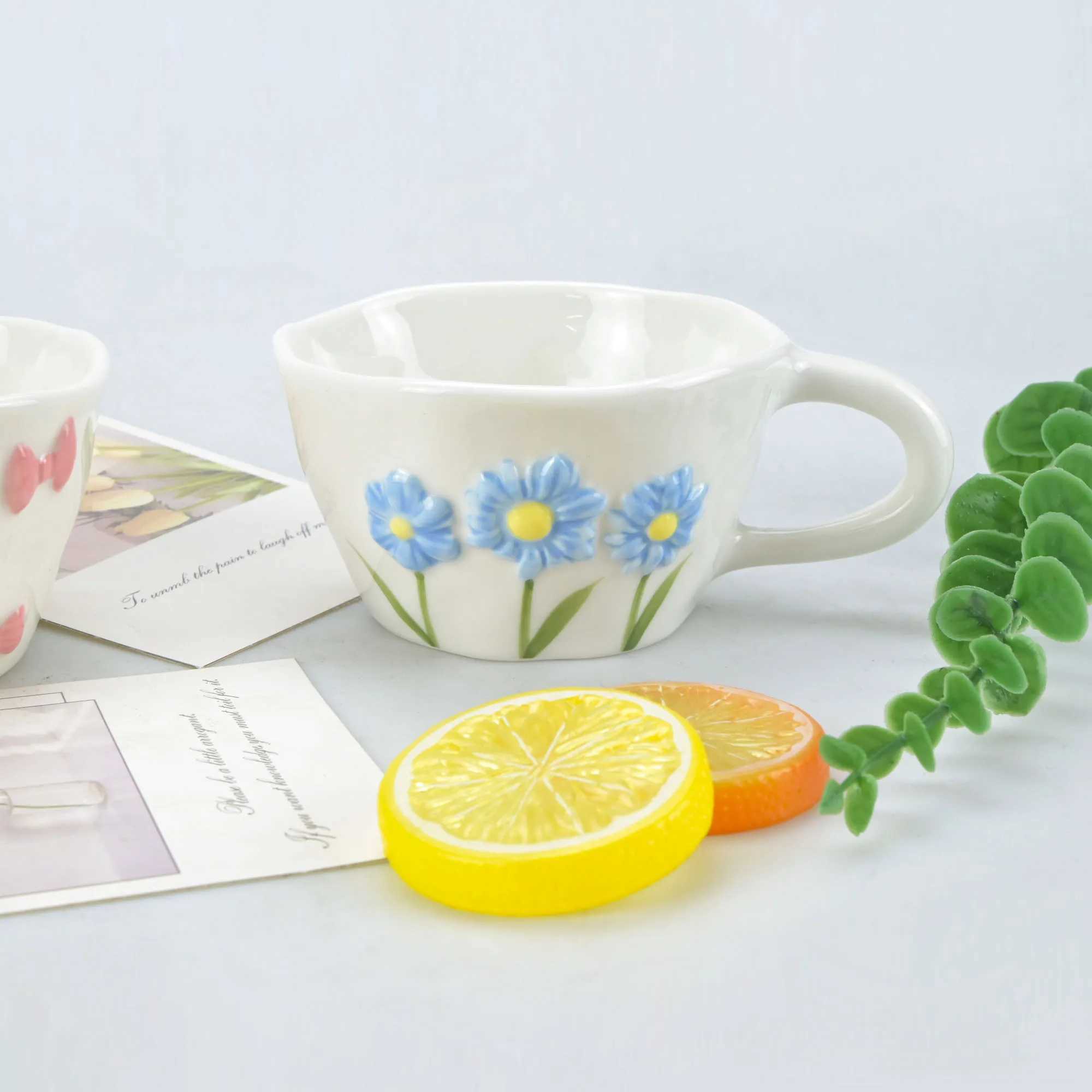 1pcs Irregular hand drawn underglaze color relief blue daisy pink bow ceramic mug water cup H260323