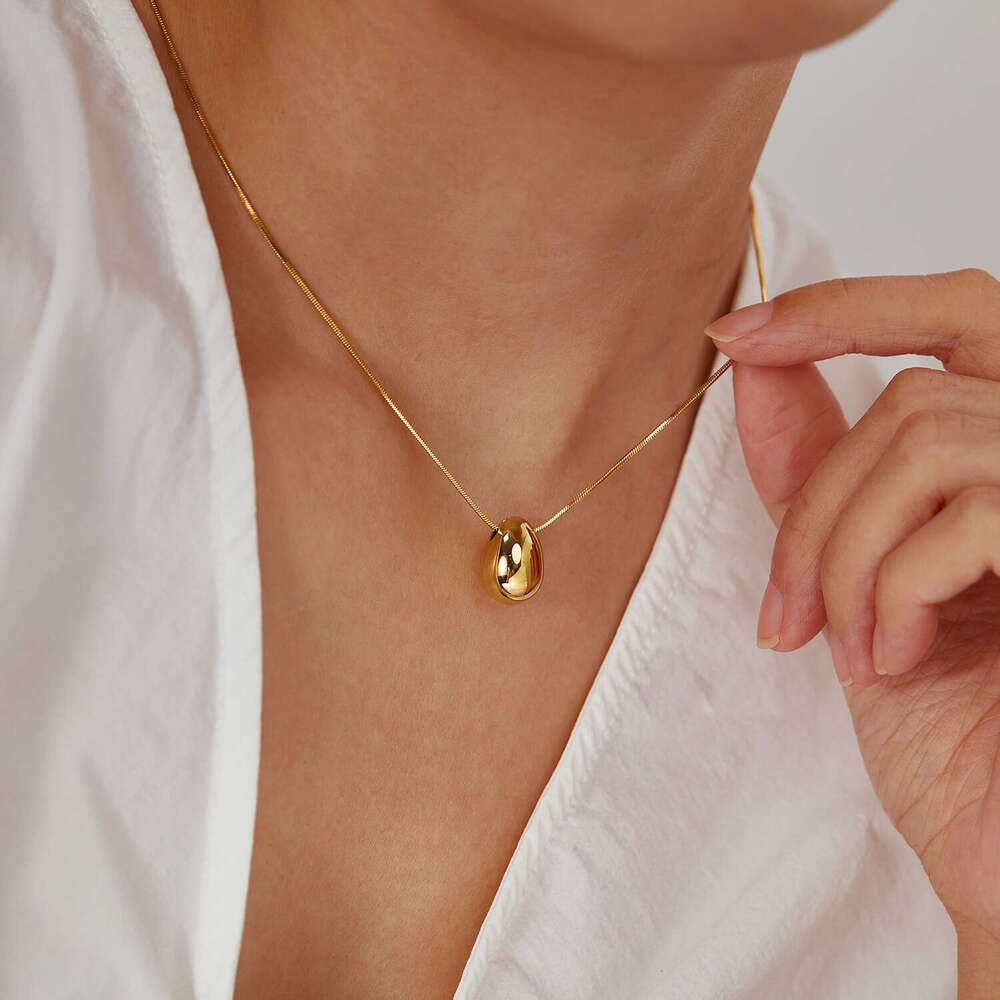 Trendy sophisticated 925 Sterling Silver 14K Gold hollow water drop necklace with a minimalist design versatile and stylish wholesale