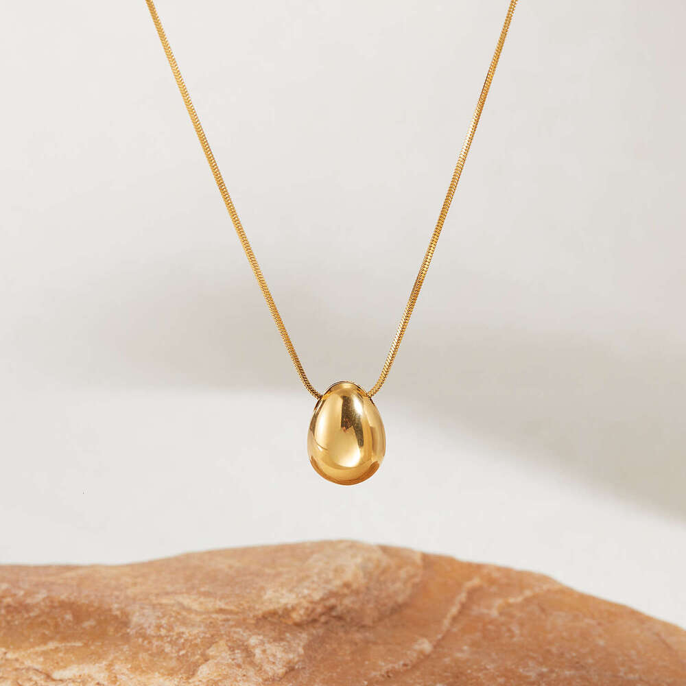 Trendy sophisticated 925 Sterling Silver 14K Gold hollow water drop necklace with a minimalist design versatile and stylish wholesale