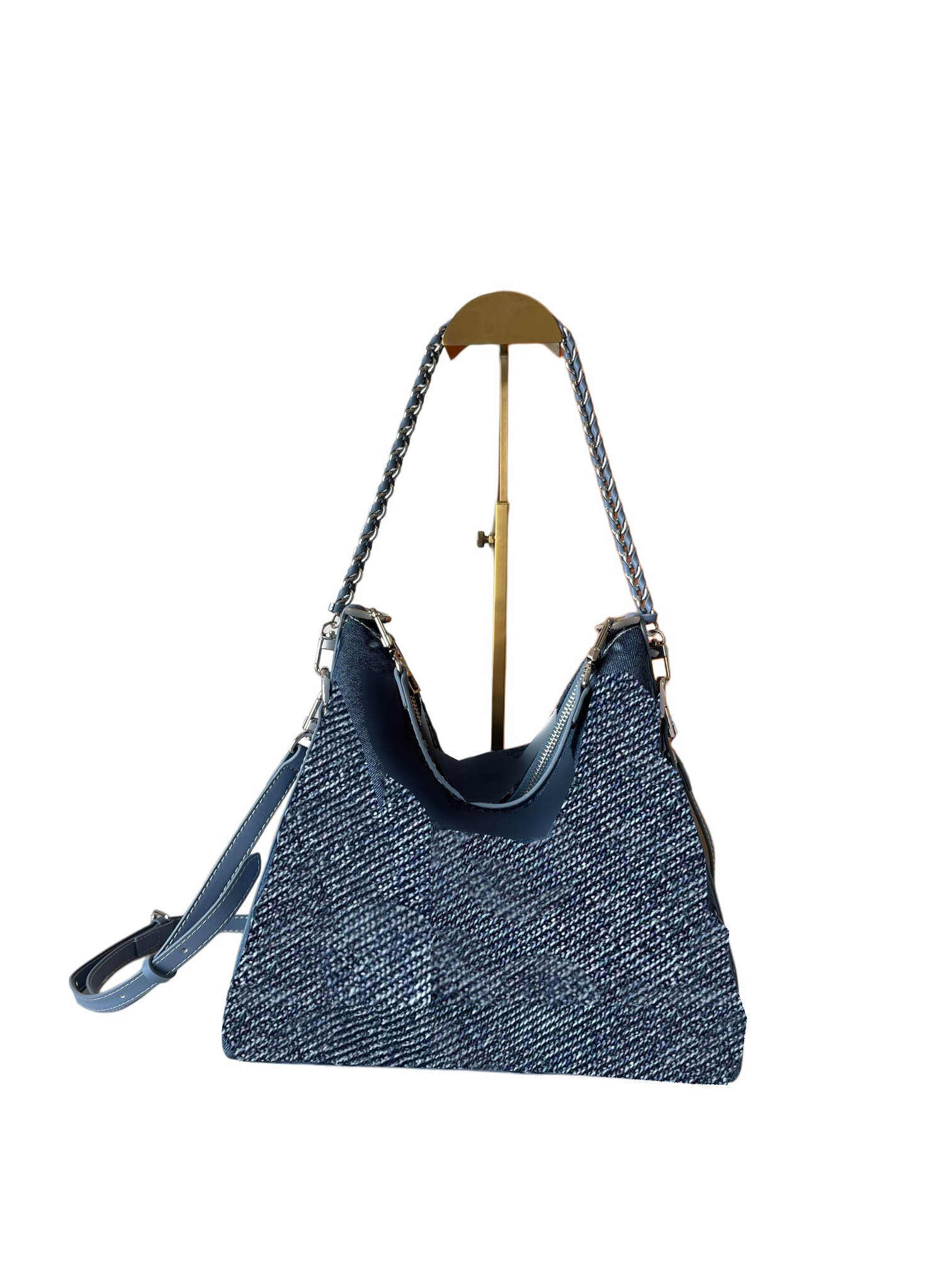This designer bag can be carried in multiple ways and accommodates daily essentials such as a tablet.