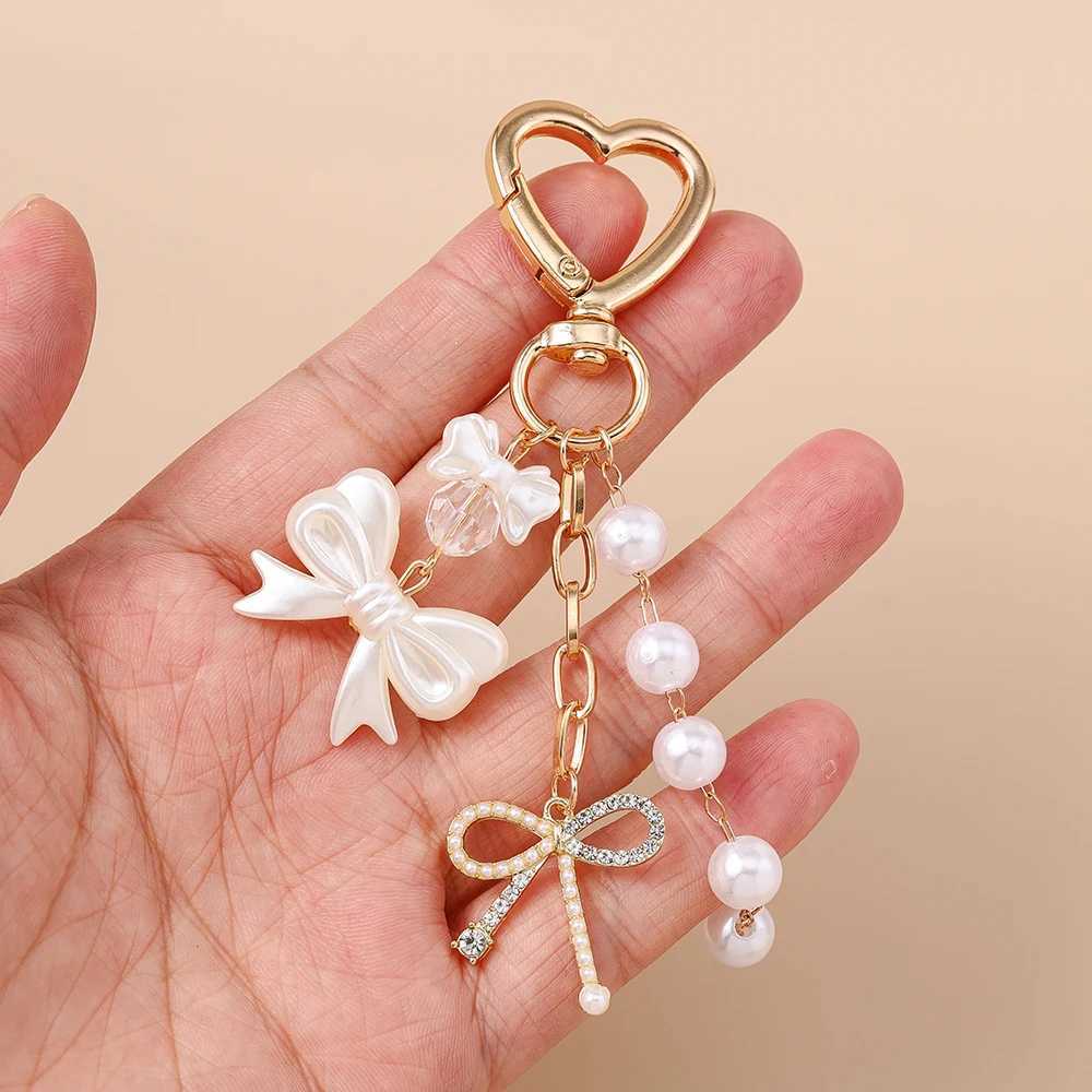 Aihua Cute Y2K Metal Pearl Love Heart Bowknot Key Chain Pearl Key Ring for Women Girl Handbag Pendants DIY Handmade Jewelry Gift Z260330
