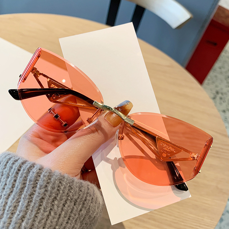 2026 Frameless Designer Sunglasses Luxury Brand Fashion Accessories New Women's Cat Eye Cutting Edge Hollow Leg Women's Outdoor Glasses Casu