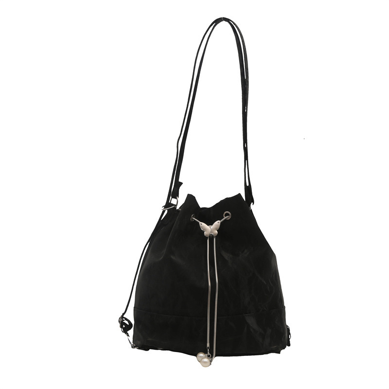 Free Shipping High Value Minimalist Retro British Style New Single Shoulder Drawstring Bucket Bag Design Sense Commuter Student Backpack