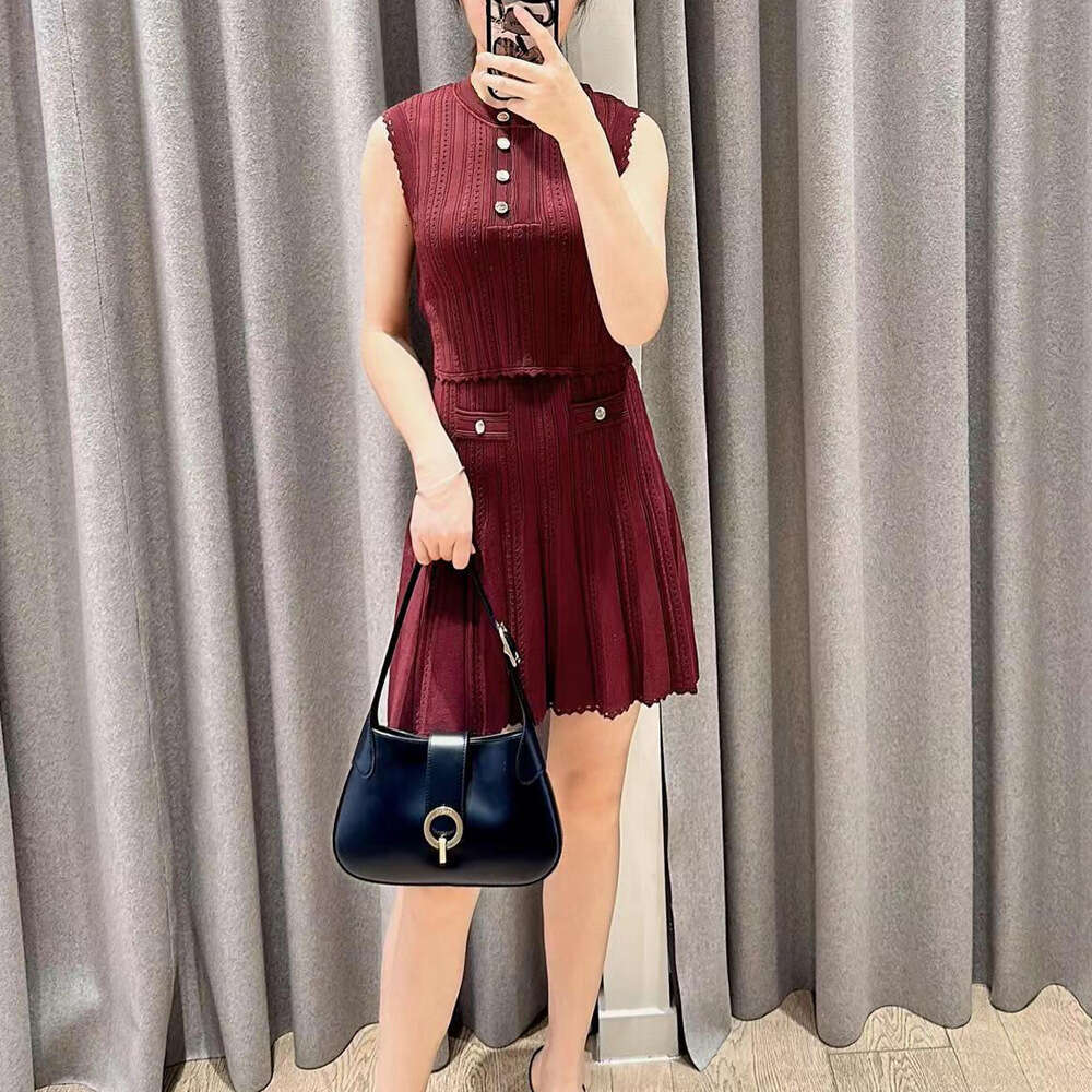 2026 autumn and winter new French round neck S18 sleeveless vest knitted top+pleated skirt women's set