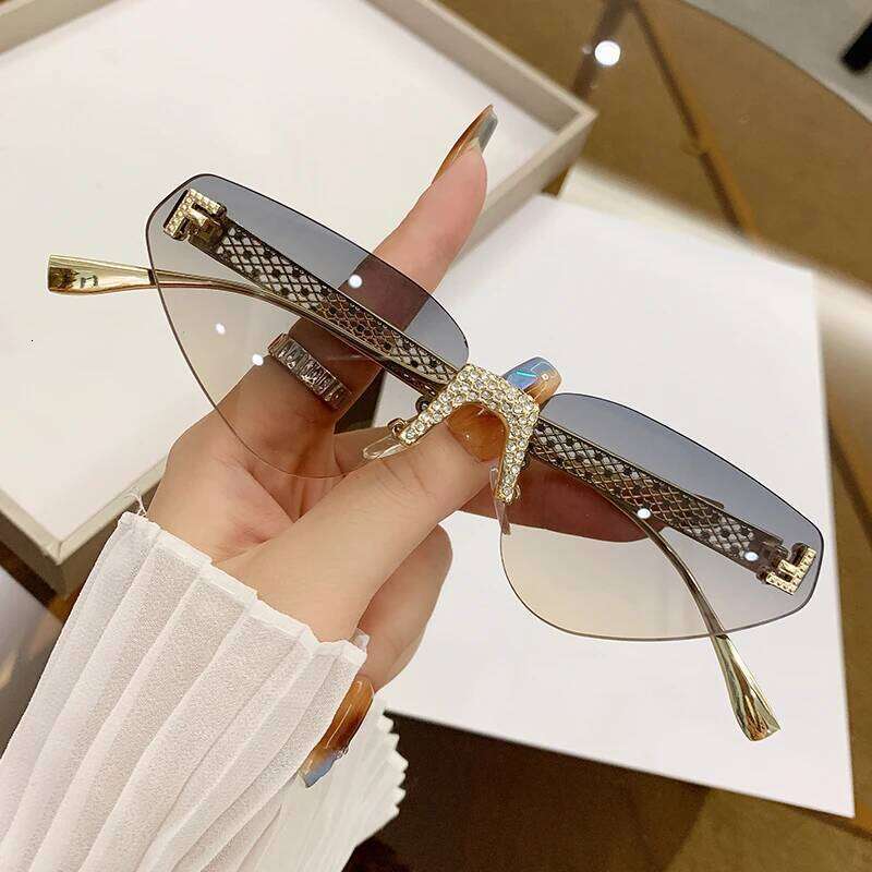 New Fashion Frameless For Women With Hollow Metal Sunglasses Cat Glasses 90259 26Y0330