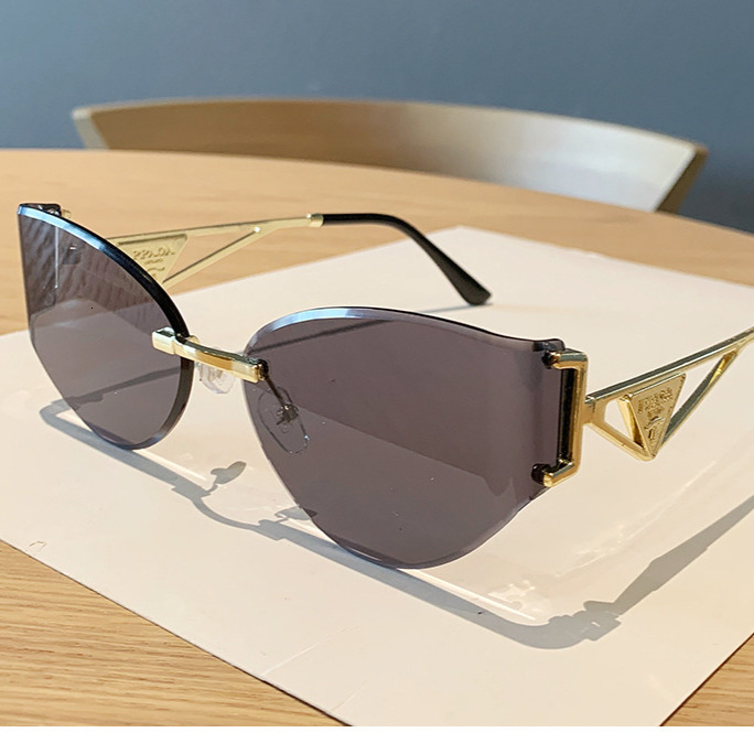 2026 Frameless Designer Sunglasses Luxury Brand Fashion Accessories New Women's Cat Eye Cutting Edge Hollow Leg Women's Outdoor Glasses Casu