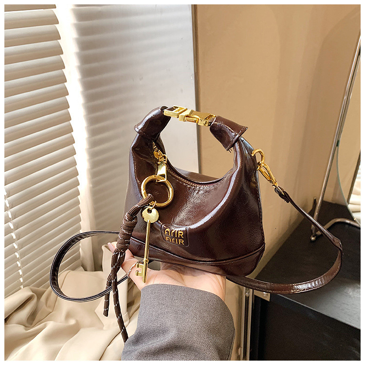 Free Shipping High Value Mini Hobo Bag for Women Glossy Leather Handbag with Key Charm Adjustable Strap