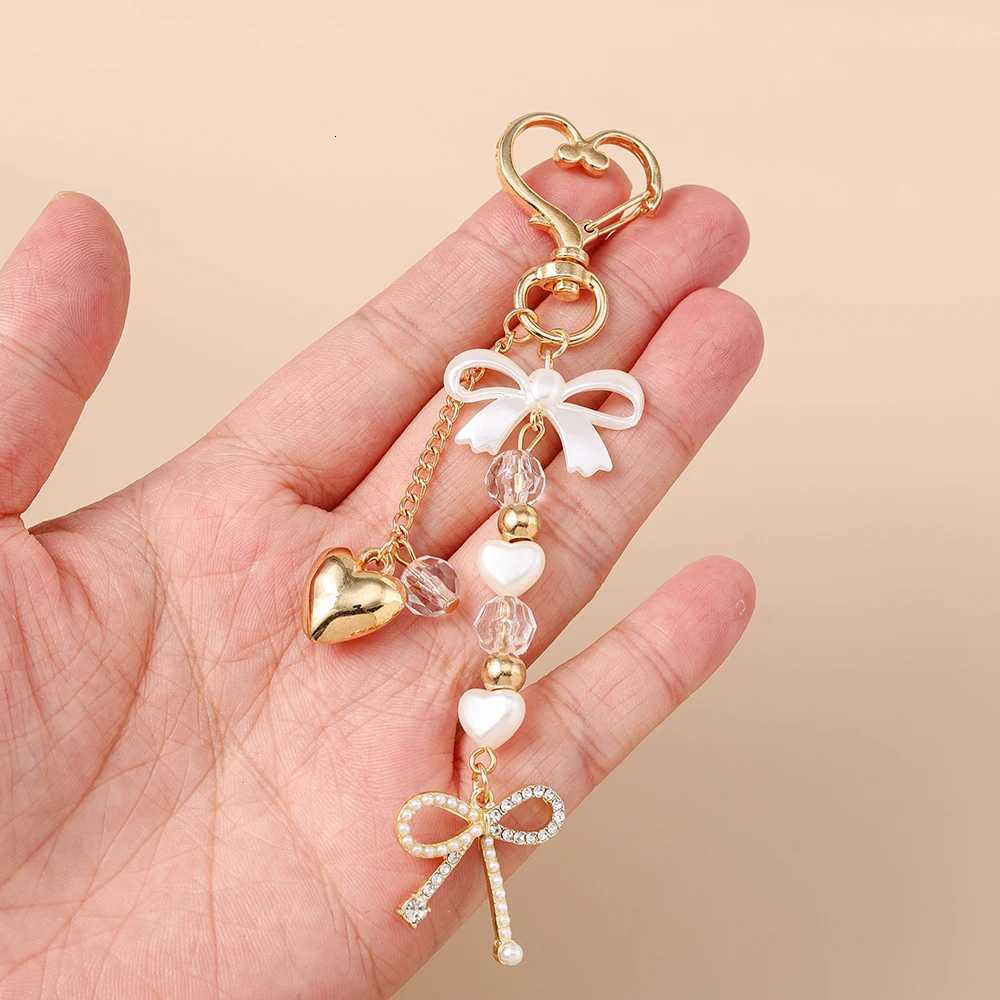 Aihua Cute Y2K Metal Pearl Love Heart Bowknot Key Chain Pearl Key Ring for Women Girl Handbag Pendants DIY Handmade Jewelry Gift Z260330