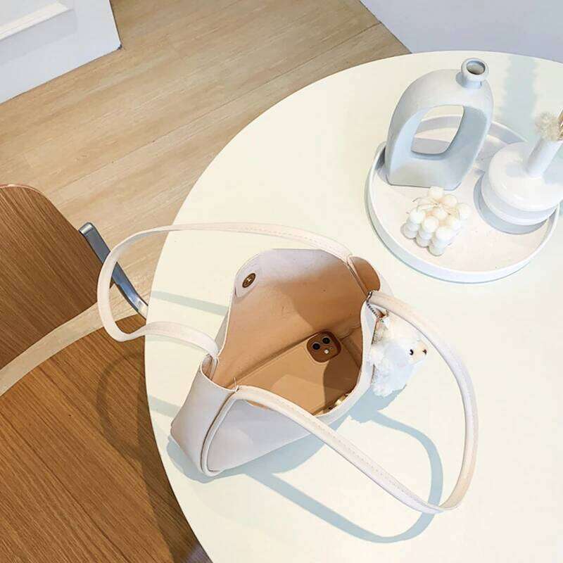 Simple And Casual New Popular PU Leather Versatile Shoulder Underarm Bag Small Fresh Solid Color Bear Pendant Handbag XIU LAI SI