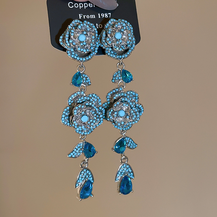 Vintage silver needle zircon hollow flower stud earrings with unique, exquisite, stunning design, offering a niche and high-end feel - view 5