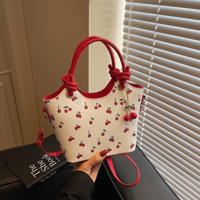 New Fashion Commuting Cute Pendant Large Capacity Printed Texture One Shoulder Underarm Handbag Bag 2026s hot
