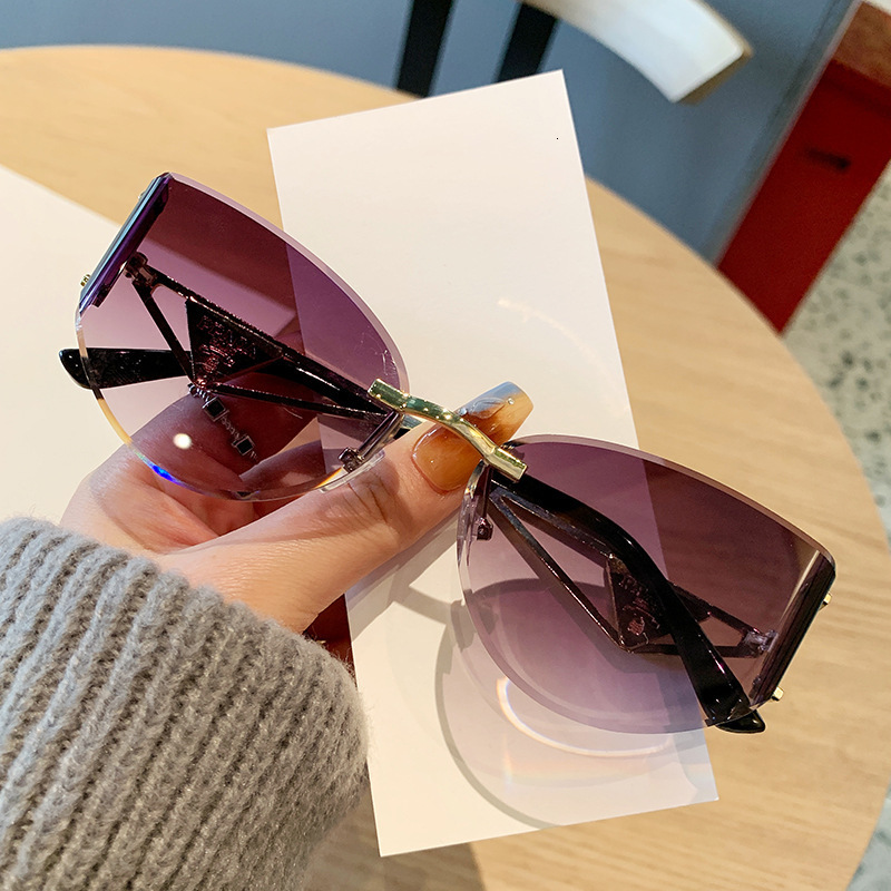 2026 Frameless Designer Sunglasses Luxury Brand Fashion Accessories New Women's Cat Eye Cutting Edge Hollow Leg Women's Outdoor Glasses Casu
