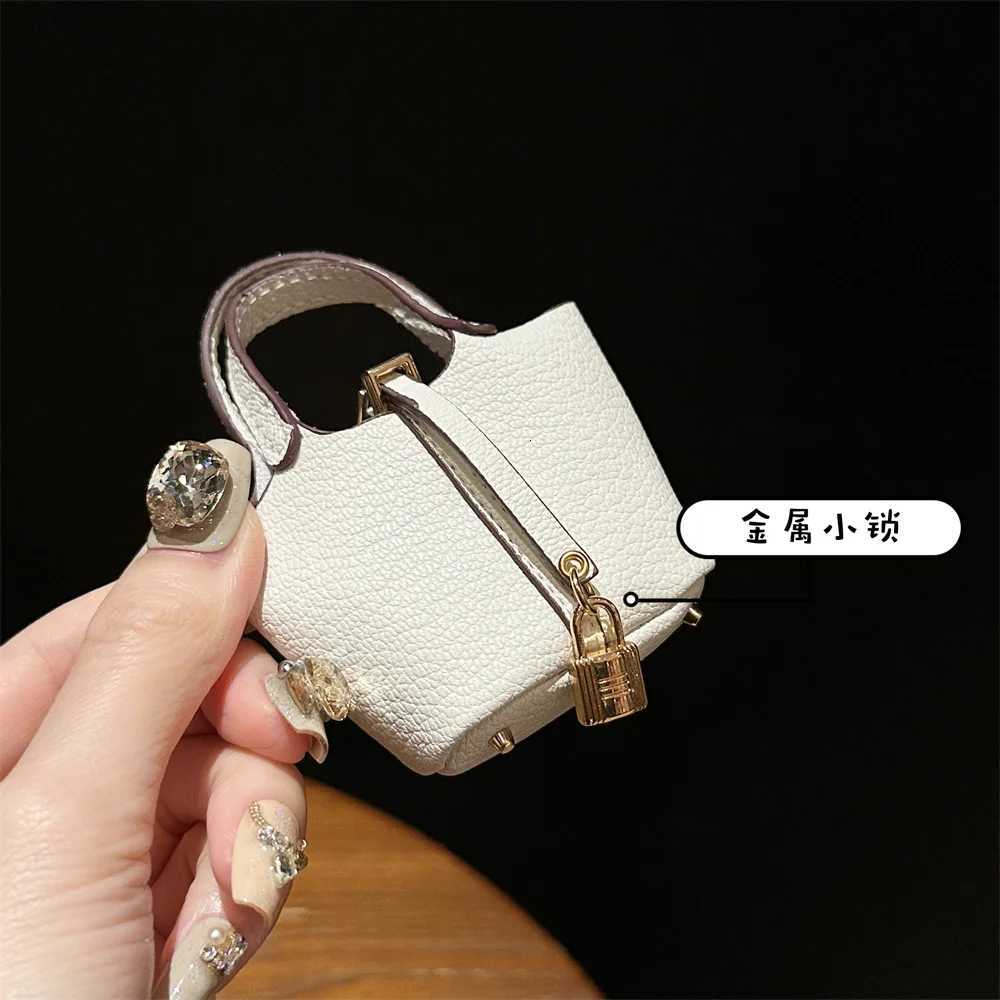2024 New style Mini House Small Bag Handheld Portable Hand Rope Bluetooth Earphone Bag Zero Wallet Multi functional Small Bag Z260330