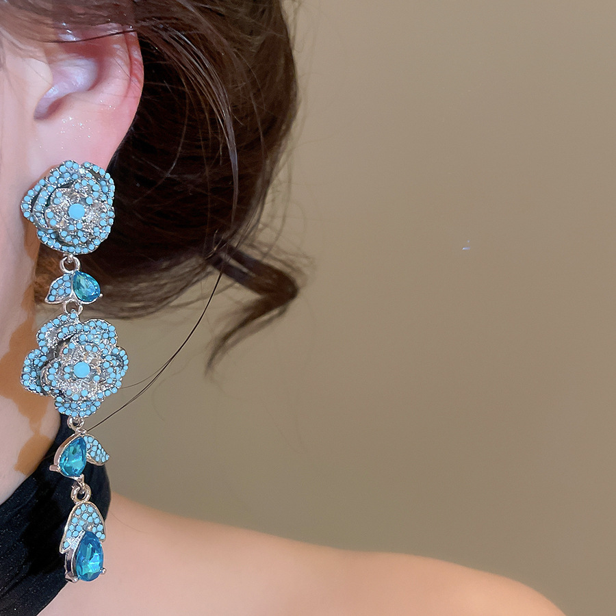 Vintage silver needle zircon hollow flower stud earrings with unique, exquisite, stunning design, offering a niche and high-end feel - view 4