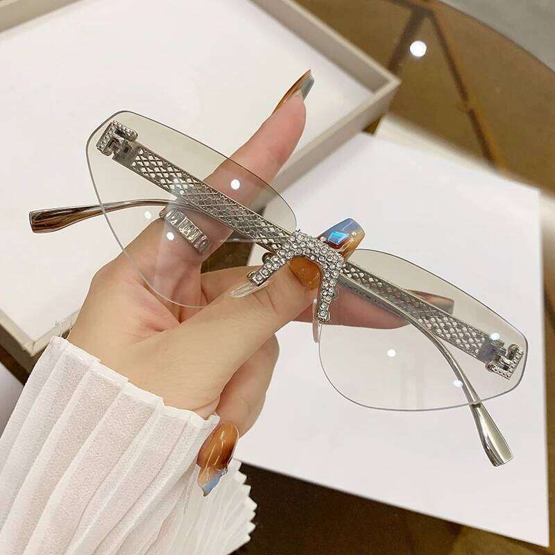 New Fashion Frameless For Women With Hollow Metal Sunglasses Cat Glasses 90259 26Y0330