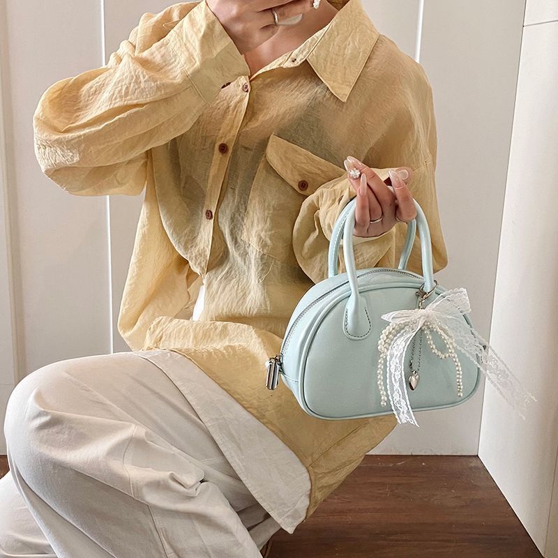 Korean Handheld Bowling for Women 2025 New Trendy Fashion Shell Niche Versatile Crossbody Bag