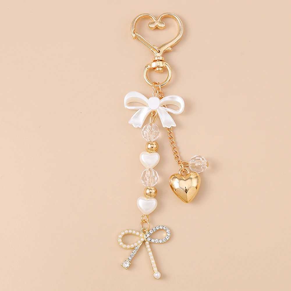 Aihua Cute Y2K Metal Pearl Love Heart Bowknot Key Chain Pearl Key Ring for Women Girl Handbag Pendants DIY Handmade Jewelry Gift Z260330