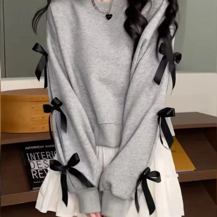 2026 new Plus-size and slightly chubby ladies' stylish and slimming sweatshirt with a bowknot design exuding elegance This long-sleeved pullover 