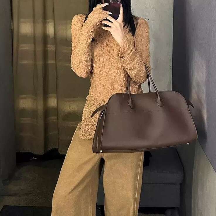 ROW S New Margaux Horizontal Cowhide Tote Bag Is Large Capacity Commuter Handbag With A Shoulder Strap For Crossbody Or Single Use SENYY