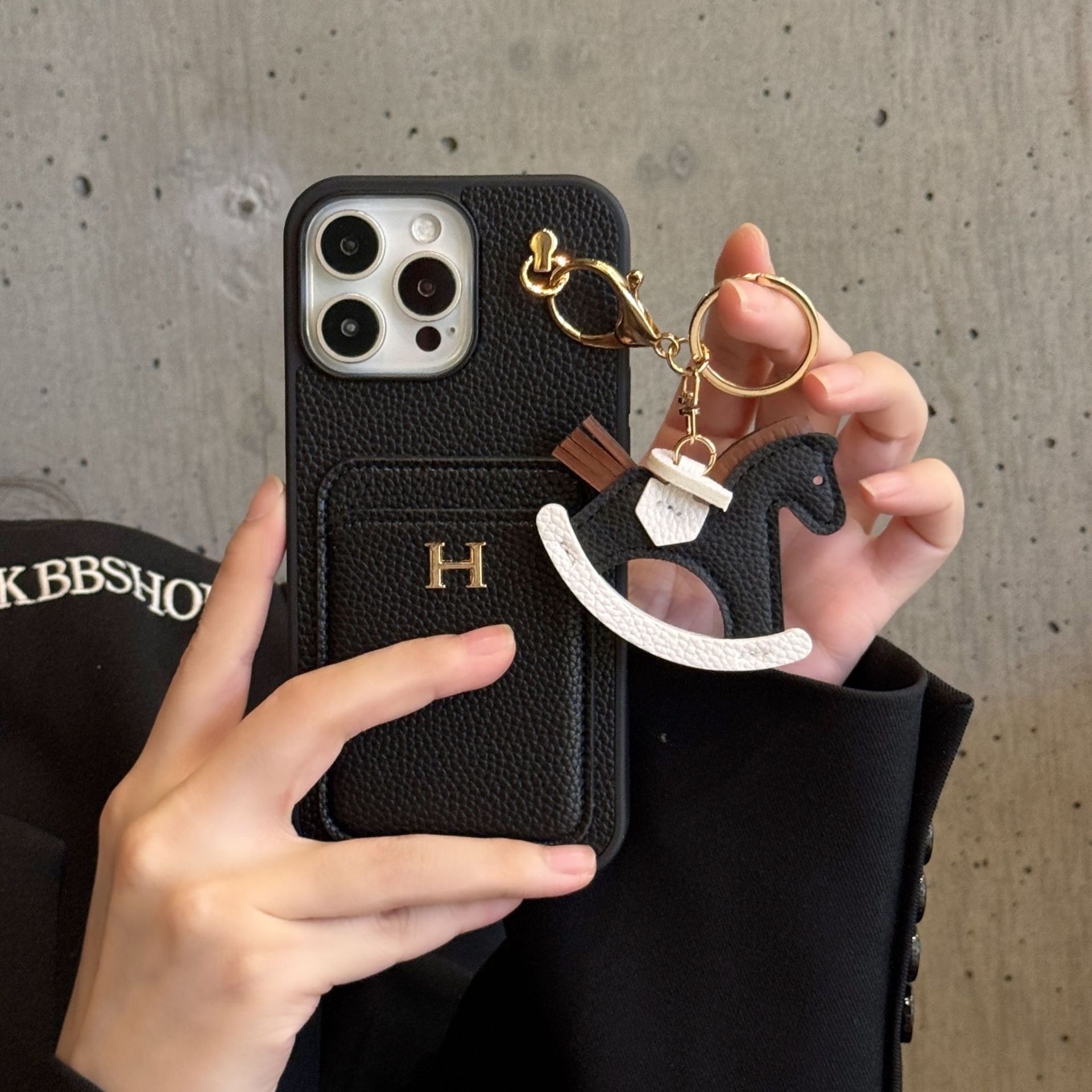 new card - inserting + rocking - horse iPhone 17 phone case with litchi - grain genuine leather feel