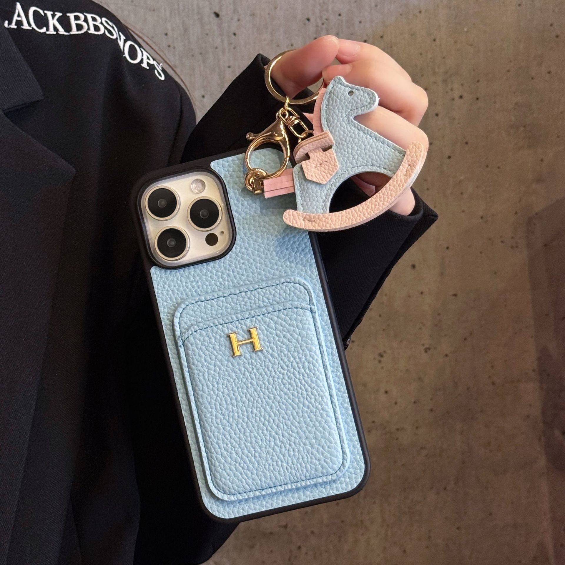 new card - inserting + rocking - horse iPhone 17 phone case with litchi - grain genuine leather feel