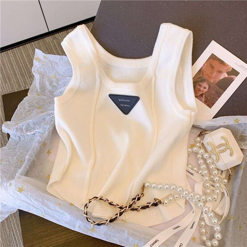 Unique And Stylish Summer New Arrival Camisole With Curved Hem, Slim Fit, Short Sleeveless Designer Fashion Tank Top