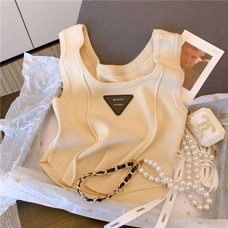 Unique And Stylish Summer New Arrival Camisole With Curved Hem, Slim Fit, Short Sleeveless Designer Fashion Tank Top