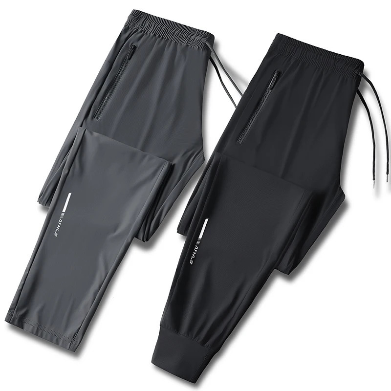 Mens solid color pants summer ice silk elastic quick drying loose sports suitable for casual and business wear M8XL 260407