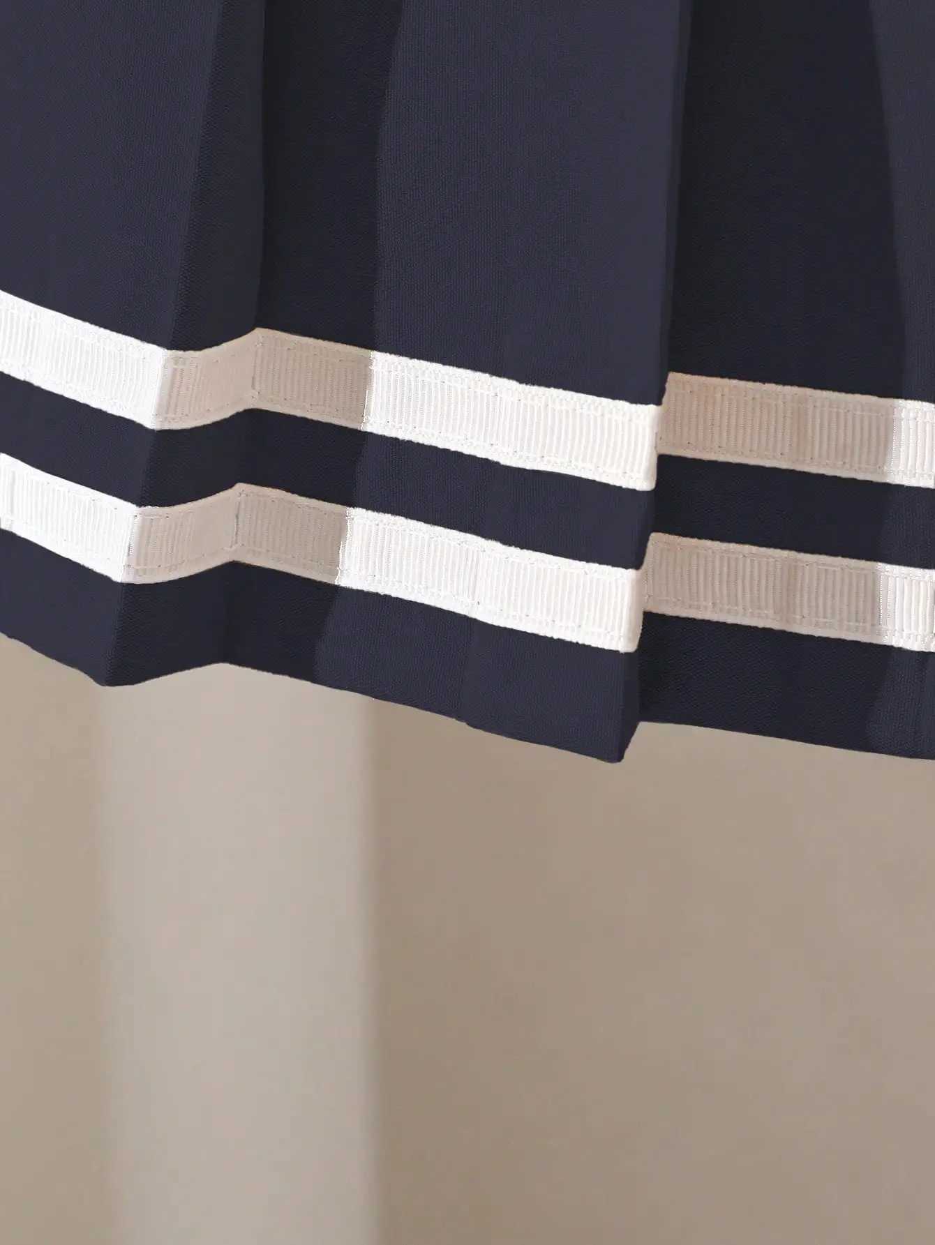 Navy Blue Pleated Skirt for Girls with White Stripe Trim and Elastic Waist H260407