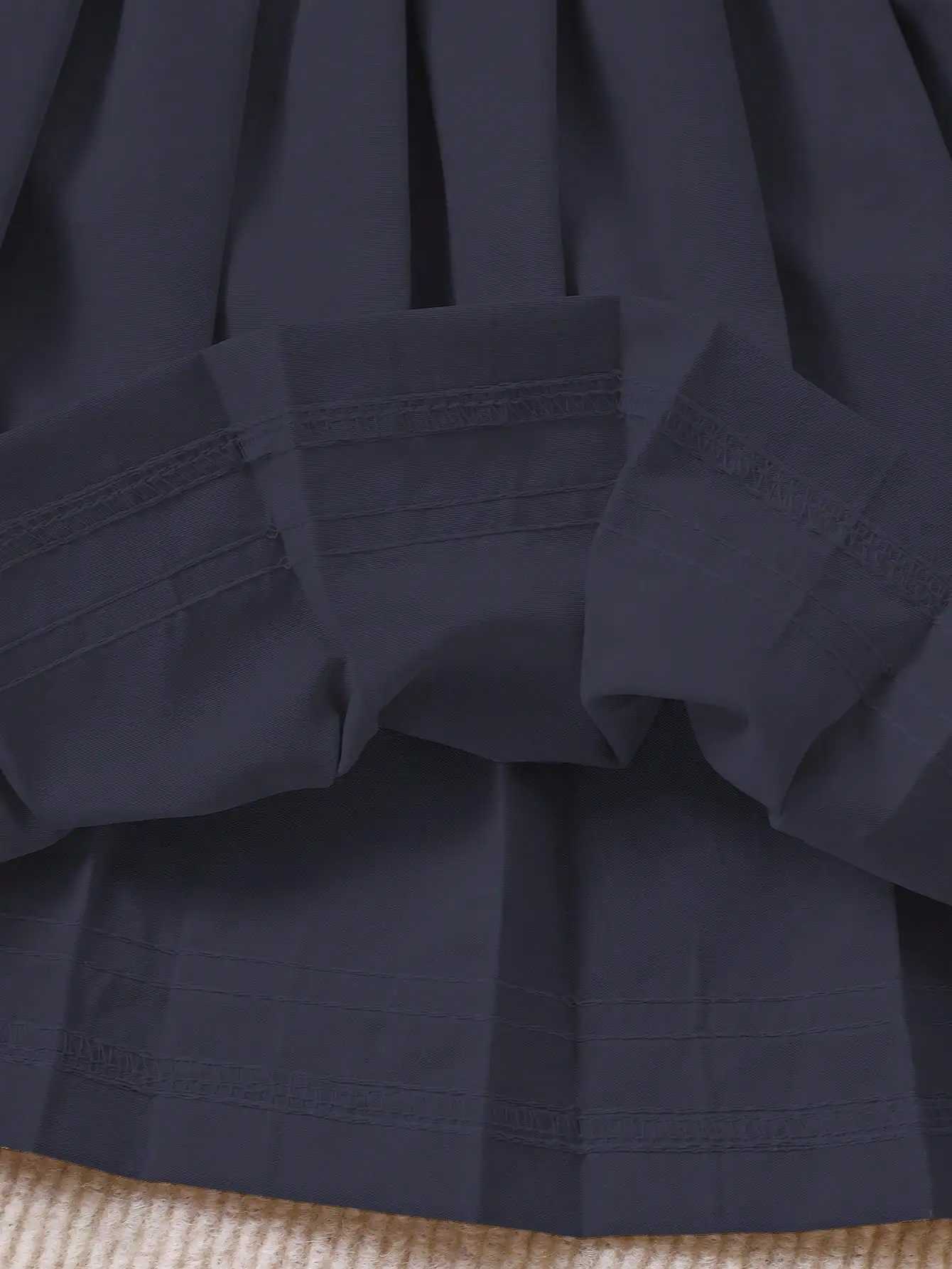 Navy Blue Pleated Skirt for Girls with White Stripe Trim and Elastic Waist H260407