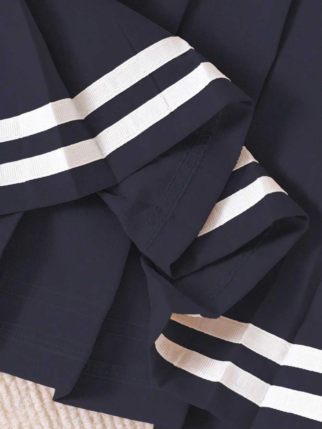 Navy Blue Pleated Skirt for Girls with White Stripe Trim and Elastic Waist H260407