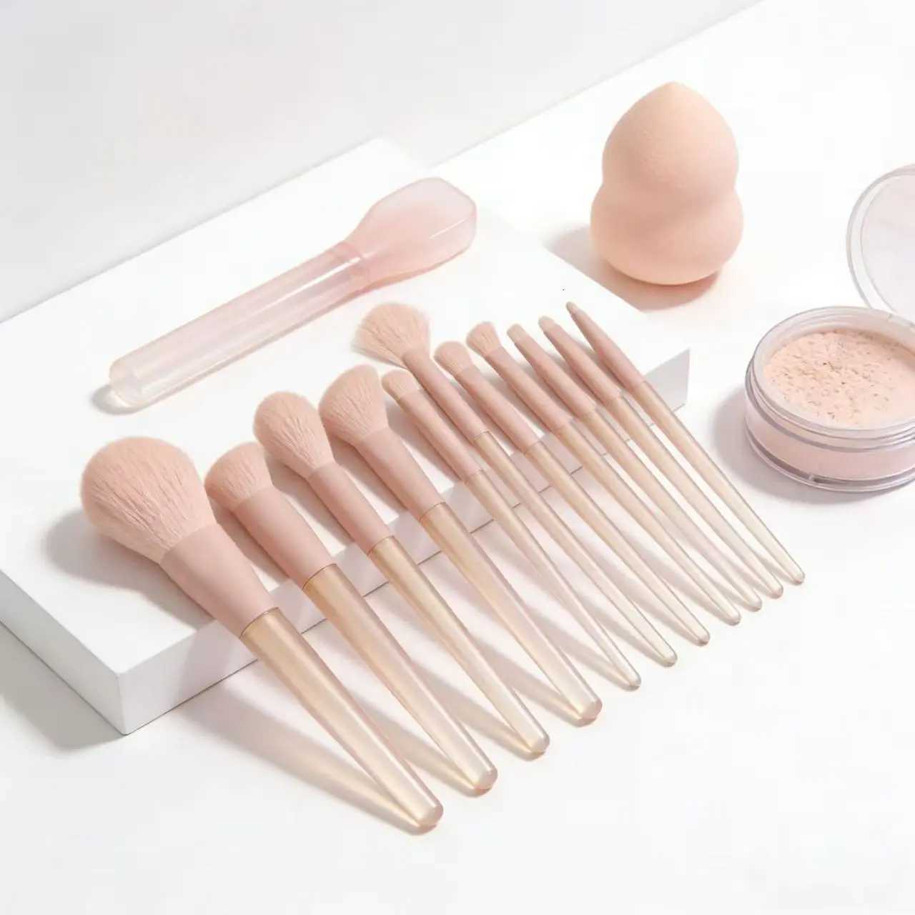 A 12-piece set of pink makeup brushes including powder foundation contouring and eyeshadow tools for makeup application Z260408
