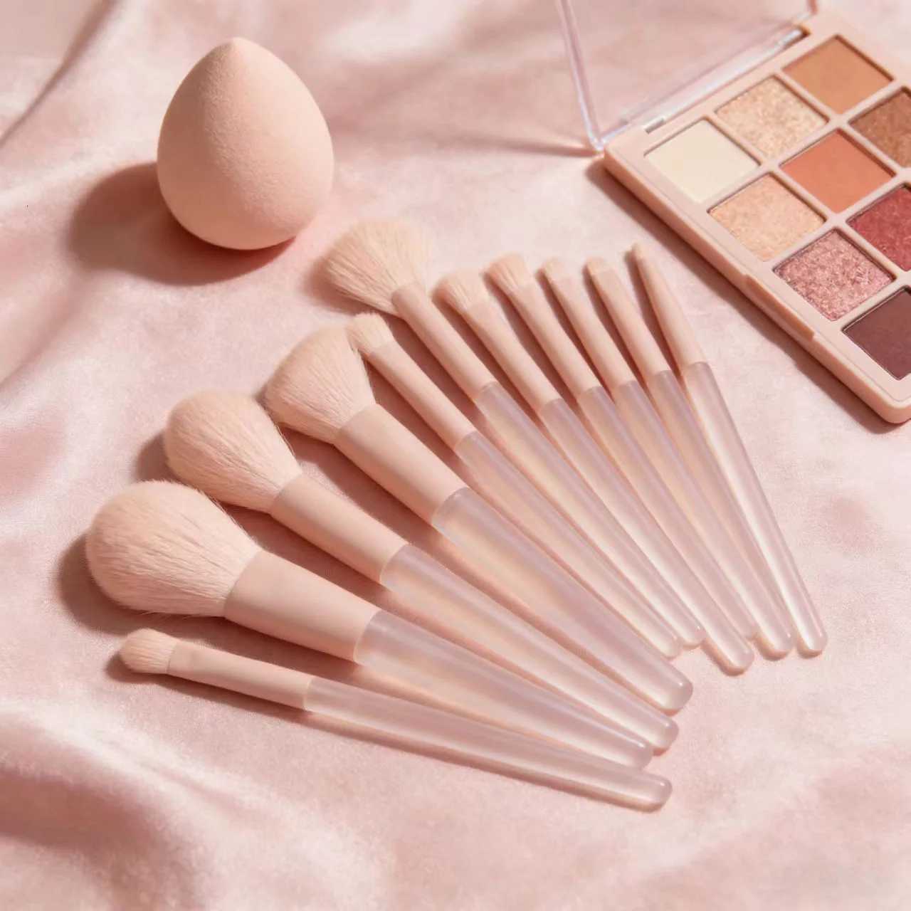 A 12-piece set of pink makeup brushes including powder foundation contouring and eyeshadow tools for makeup application Z260408