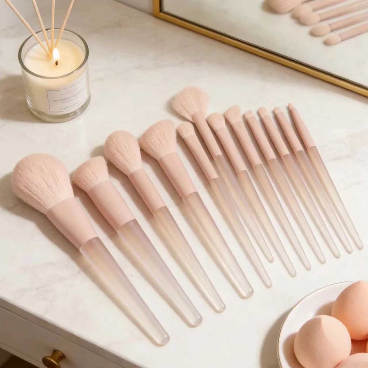 A 12-piece set of pink makeup brushes including powder foundation contouring and eyeshadow tools for makeup application Z260408