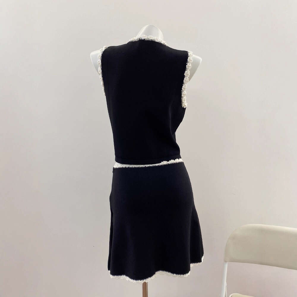 New design for spring and summer of 2026, featuring French aurora style with floral crochet vest and k30 contrasting A-line short skirt