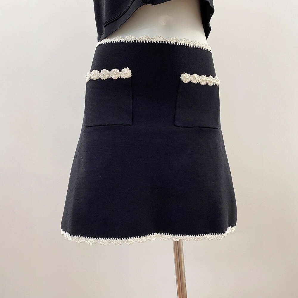 New design for spring and summer of 2026, featuring French aurora style with floral crochet vest and k30 contrasting A-line short skirt