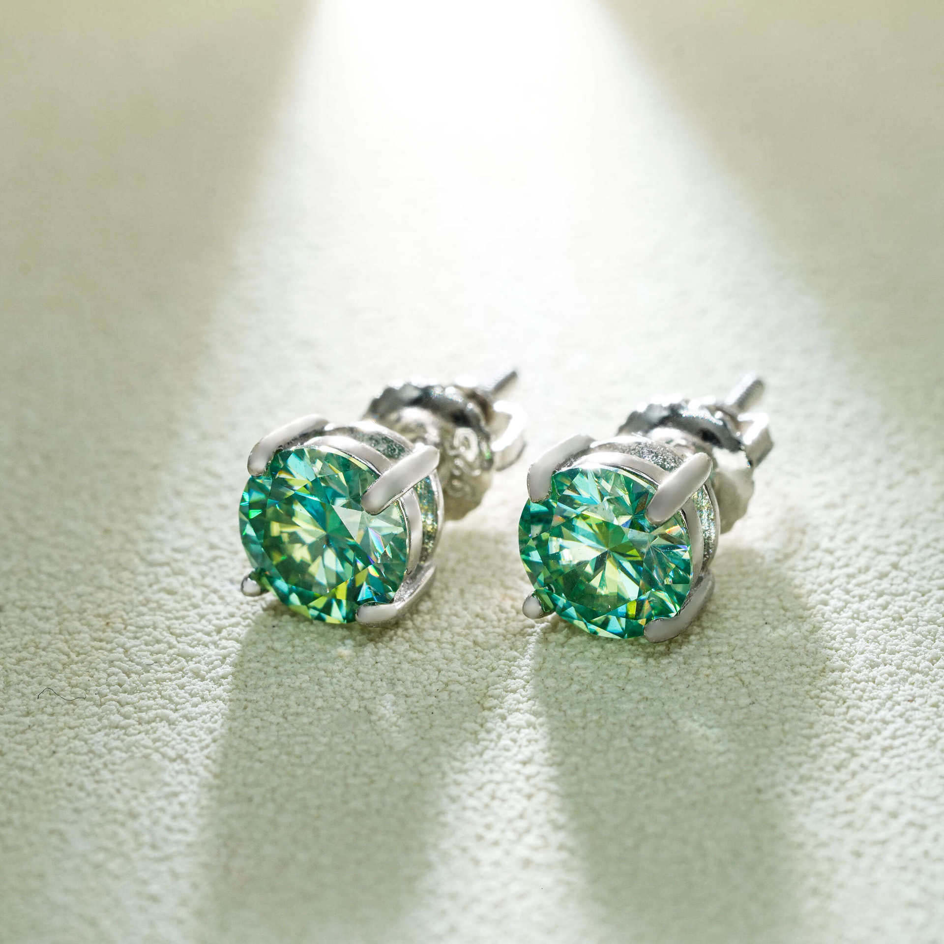 Single stone four-prong blue-green moissanite stud earrings S925 silver unisex available in multiple sizes simple earrings