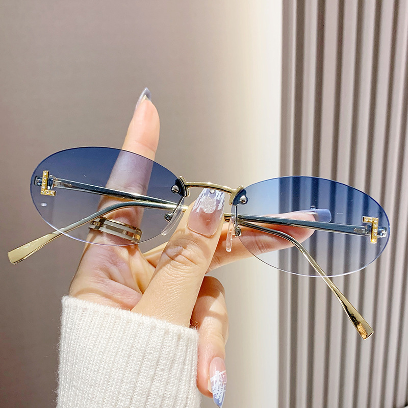 2026 New Model Designer Frameless Letter Sunglasses For Outdoor Beach Retro Round Small Frame Metal Elliptical Border Sunglasses For Both Men And Wome