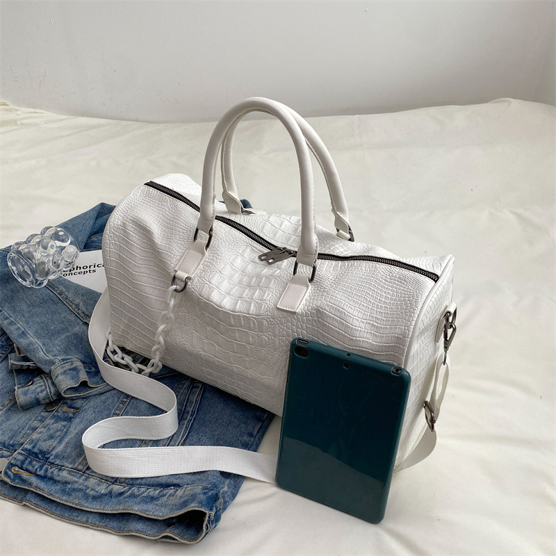 Free Shipping Short Travel Bag Large Capacity Soft Leather Waterproof Fitness Bag New Lightweight Weekend Bag Tide Women