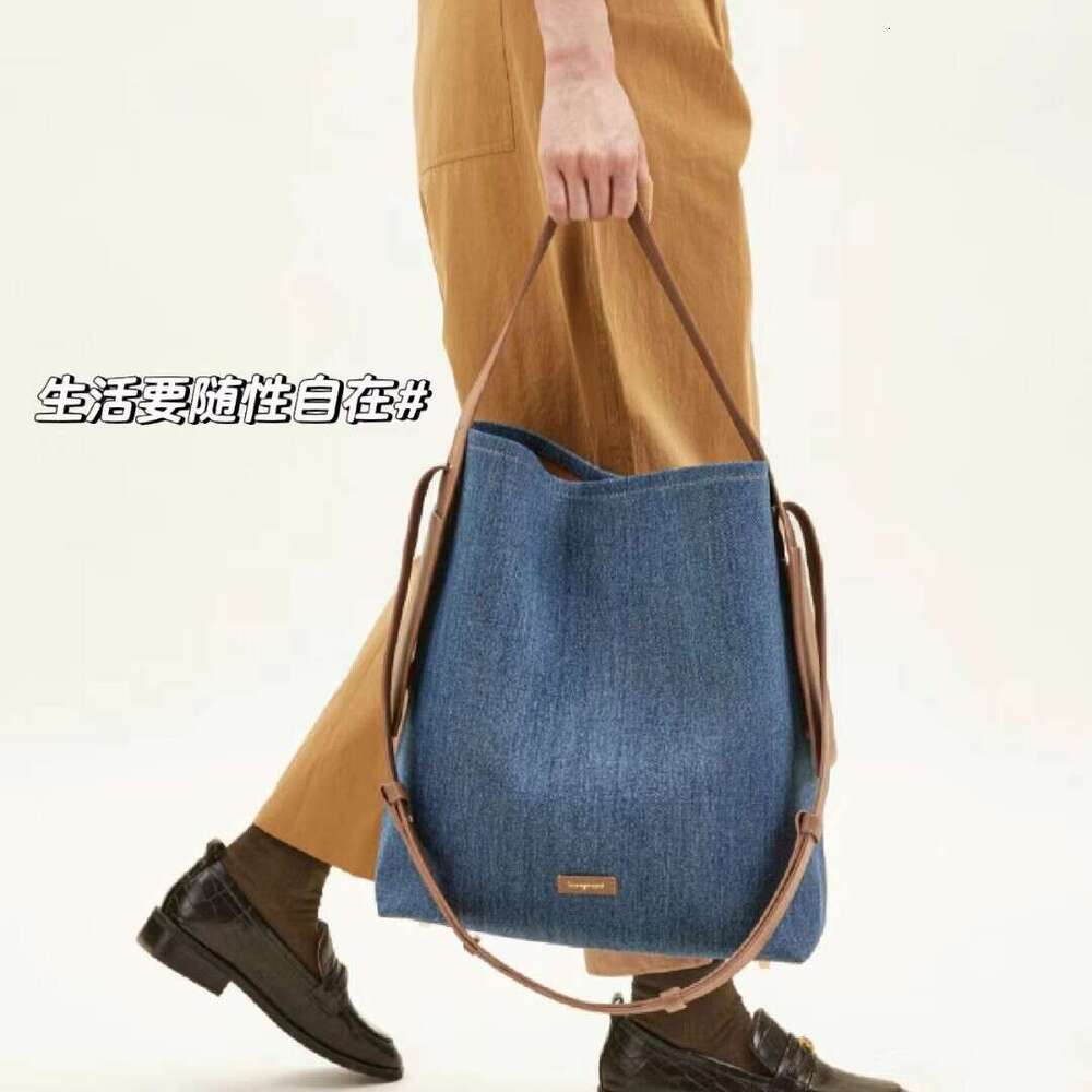 2026 New Genuine Leather Hanging Ear Tote Bag For Women 14 Inch Laptop Bag Large Capacity Shoulder Crossbody Bag Luxury Commute Bag SENYY