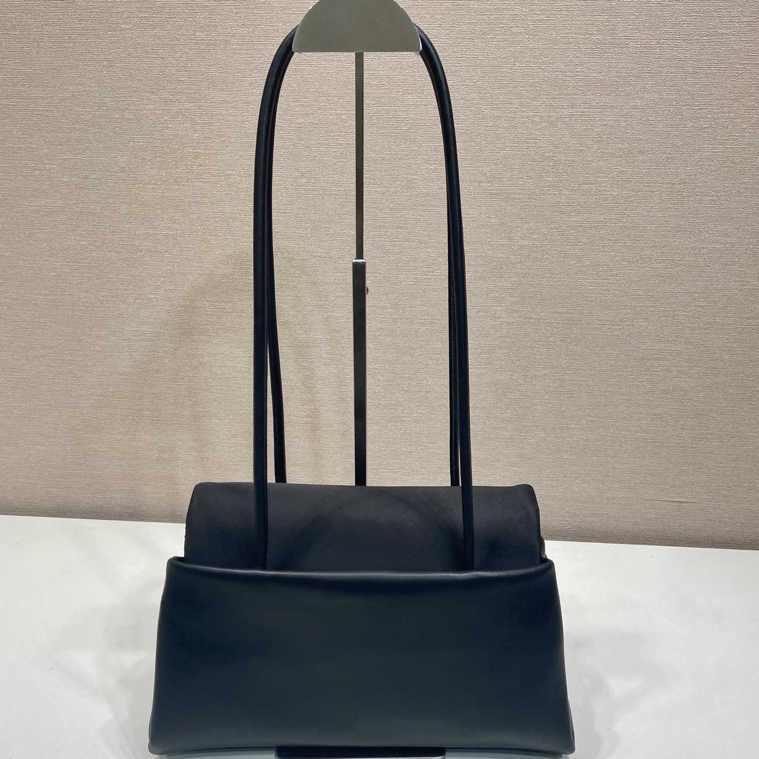 10A Designer Leather and Nylon Tote with Structured Silhouette Three Inner Pockets Folded Sides Long Handles for Functional Modern Style
