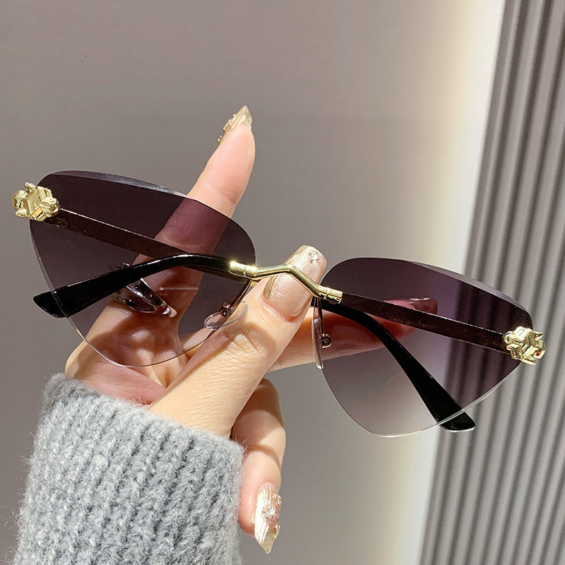 Cross Border Luxury Cat Eye Ocean Lens Designer Sunglasses New Metal Cutting Edge Outdoor Sunshade Sunglasses Runway Show Cheetah Triangle Glasses