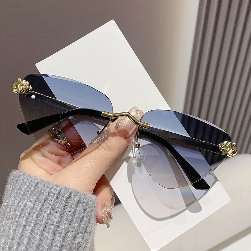 Cross Border Luxury Cat Eye Ocean Lens Designer Sunglasses New Metal Cutting Edge Outdoor Sunshade Sunglasses Runway Show Cheetah Triangle Glasses